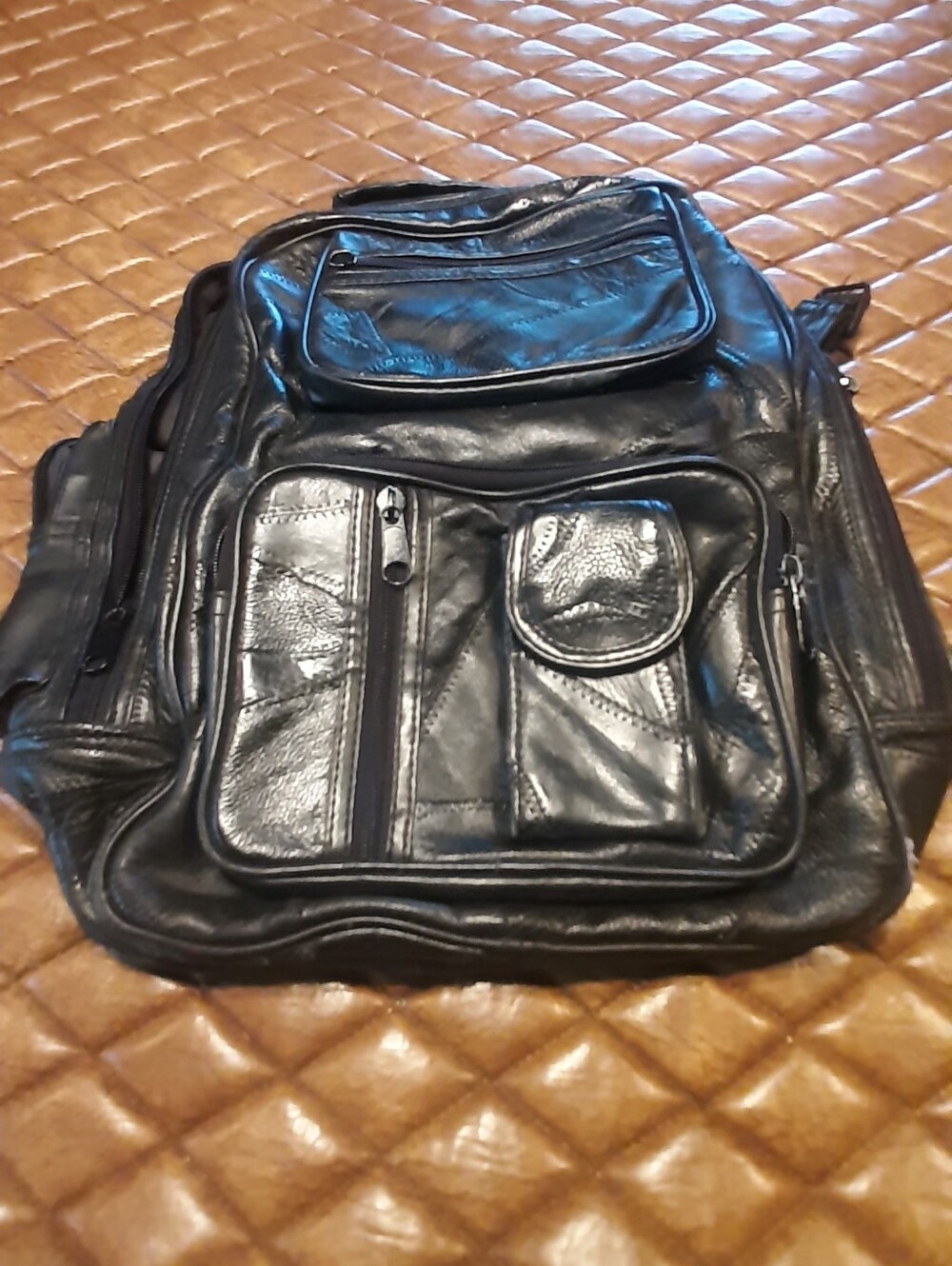 Woman's Black Leather Multi-Pocket Backpack